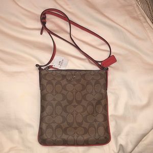 Authentic Coach cross body bag..with tags
